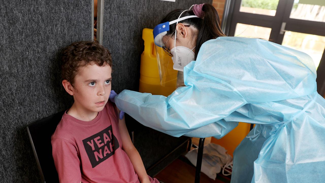 Christian McArthur, 9, getting his first Pfizer vaccination with nurse Charmaine Chia. Picture: Tara Croser