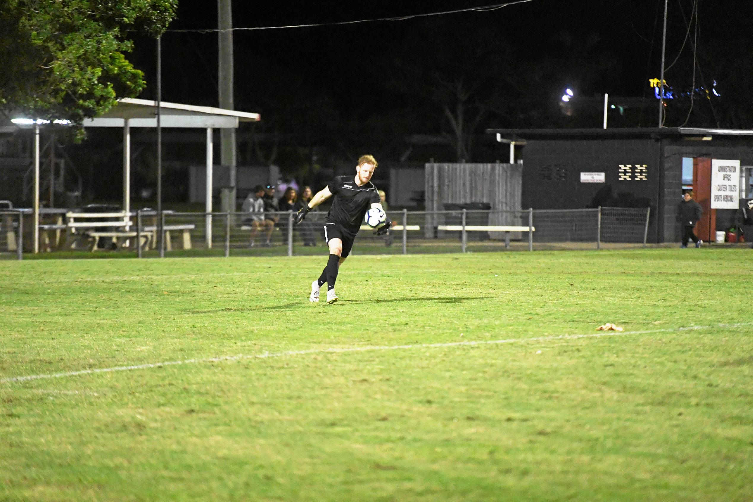 The Waves Sam Collinson boots the ball from the penalty box. Picture: Shane Jones