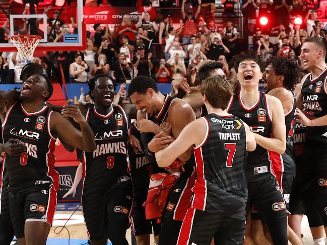 Illawarra Hawks players celebrates their win after game five of the 2024/25 NBL Grand Final series. Picture: Darrian Traynor/Getty Images