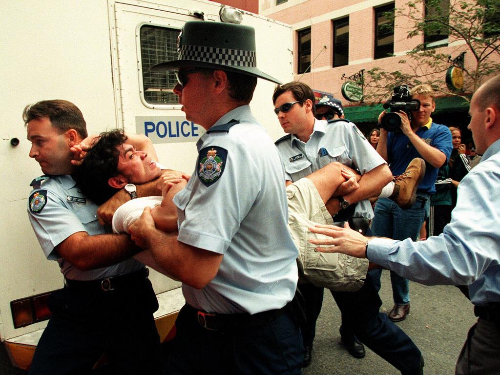 A protester is arrested outside a One Nation meeting in Brisbane, October 1997.