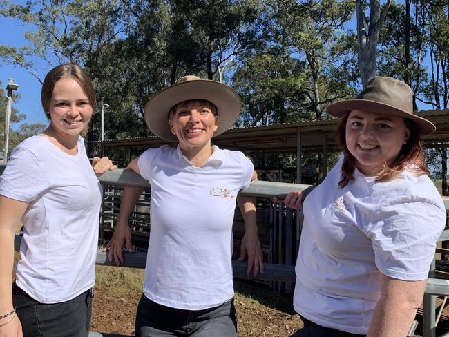 (L-R) Farm foster mum Kirra Smith, Til The Cows Come Home farm animal charity founder and CEO Donna Wild, and rescue team coordinator Phoebe Wisken with the 27 head of cattle bound for their forever home.