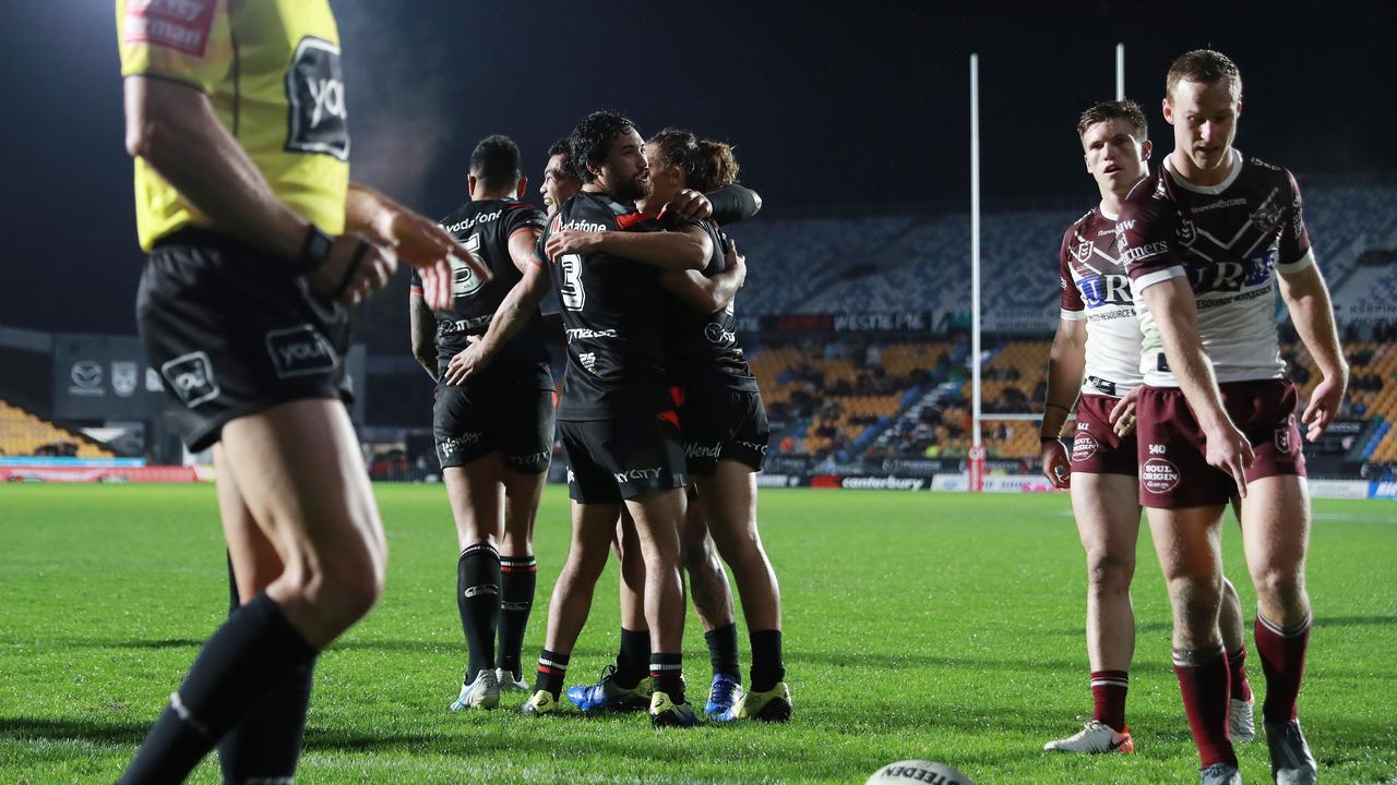 The Warriors celebrate a try scored by Ken Maumalo against the Sea Eagles.