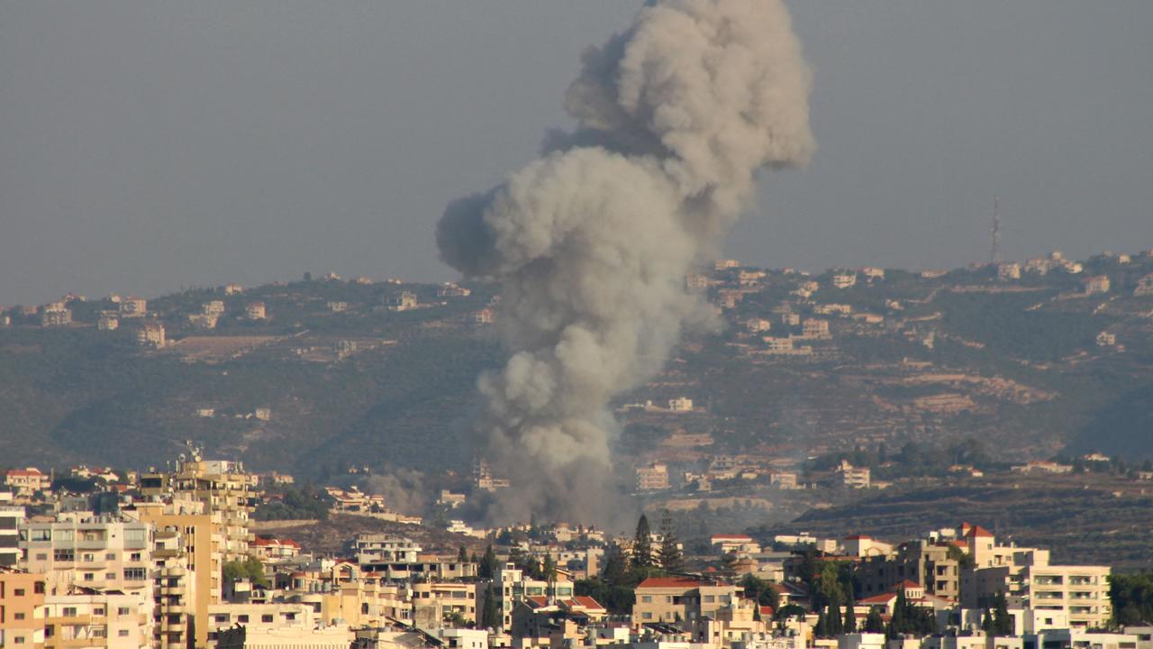 Smoke billows over the Lebanese village Abbasiyeh after an Israeli strike. Picture: Kawnat Haju/AFP