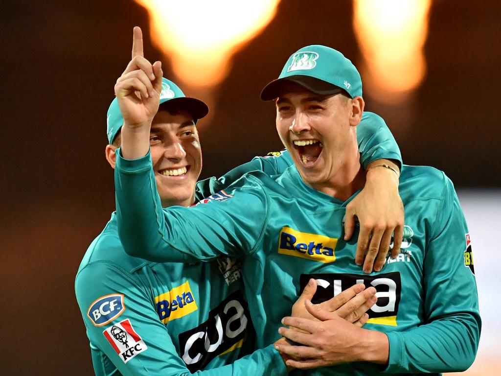 Tom Banton (left) and Matthew Renshaw (right) celebrate catching out Matthew Wade. (AAP Image/Darren England)