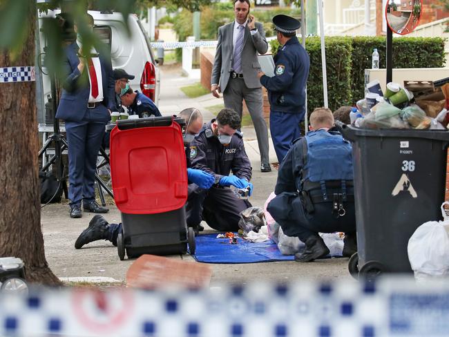 Police collect evidence at the Lakemba address. Picture: Toby Zerna