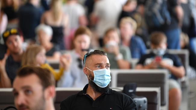 Passengers wait for flights at Adelaide Airport on Monday. Picture: David Mariuz