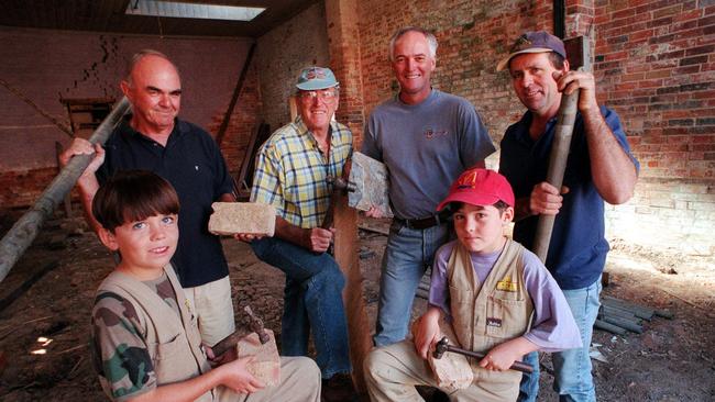 Then: Norm Jones, Max Kau, Alan Denham and Alistar Hull with (front) Mathew and Nicholas Hull clearing out London House in 2000.