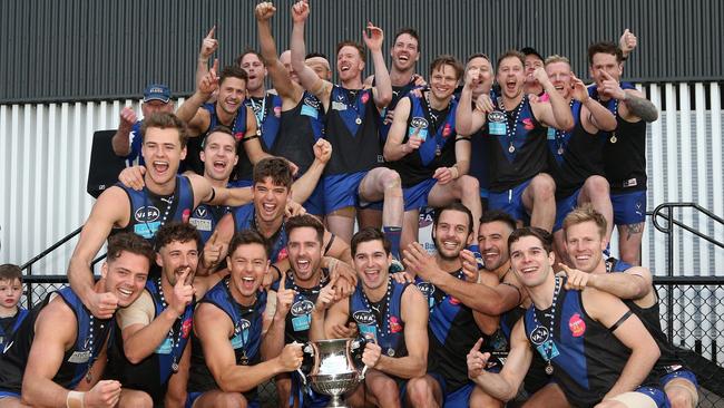 University Blues celebrate their 2019 VAFA flag. Picture: Hamish Blair