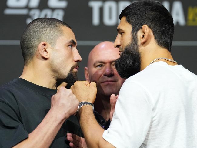 ABU DHABI, UNITED ARAB EMIRATES - OCTOBER 24: (L-R) Opponents Robert Whittaker of New Zealand and Khamzat Chimaev of Russia face off during the UFC 308 press conference at Etihad Arena on October 24, 2024 in Abu Dhabi, United Arab Emirates.  (Photo by Chris Unger/Zuffa LLC)