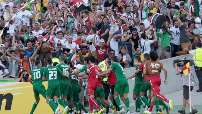 Iraqi players celebrate a stunning win.