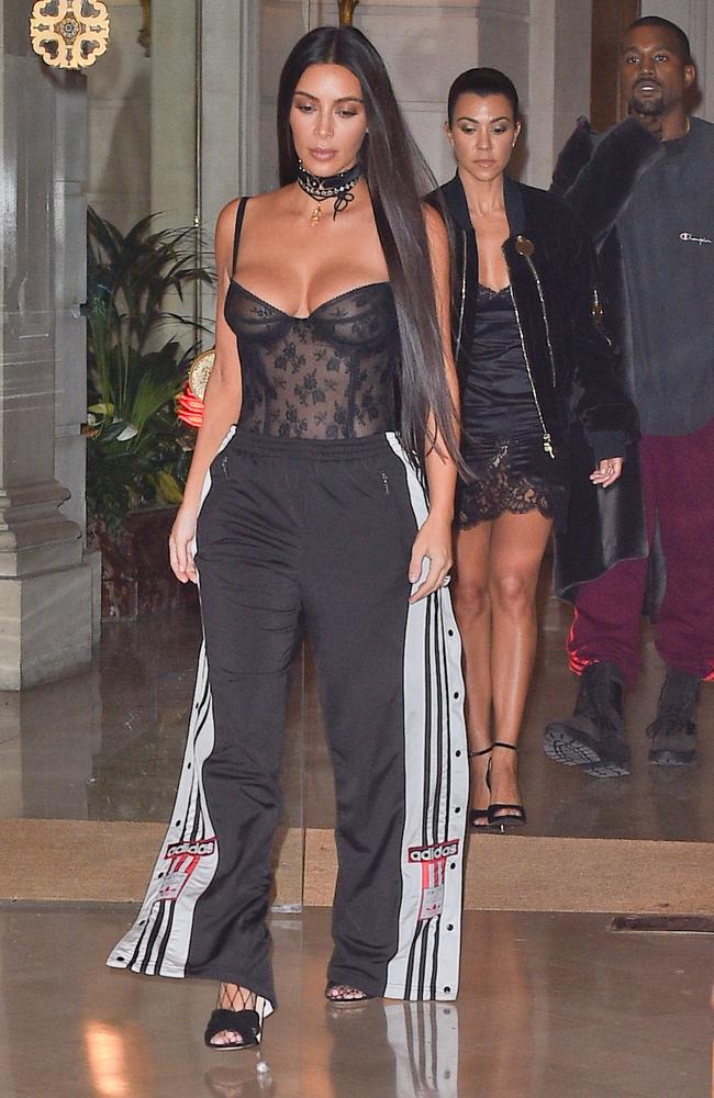 Kim Kardashian is seen at Givenchy in Paris with Kanye West and sister Kourtney Kardashian. Picture: Splash