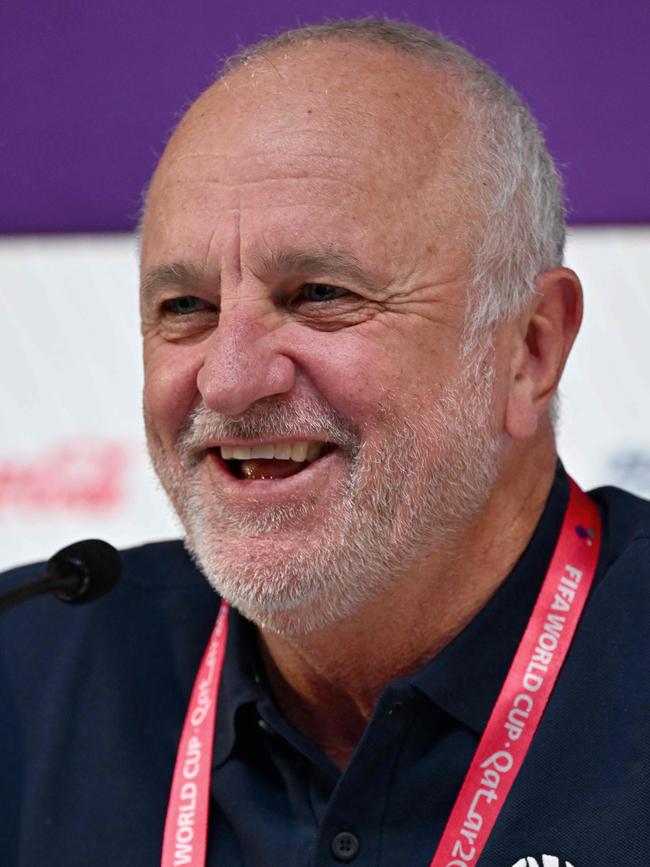 Australia's coach Graham Arnold has a laugh with journalists.