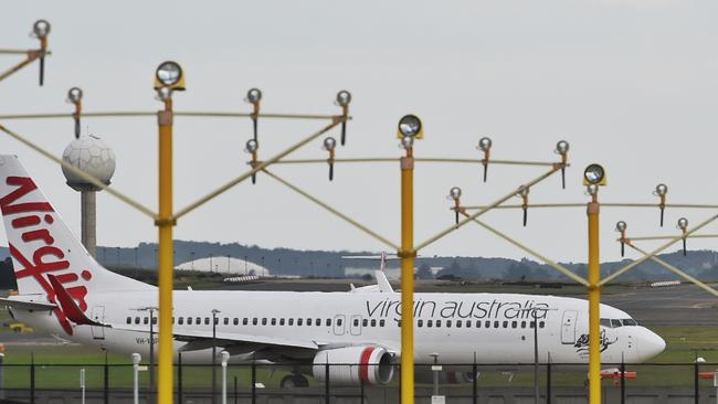 A Virgin Australia passenger plane prepares to take off at Sydney airport