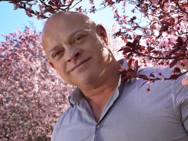 At Penfold Park, Darren Ray (meteorologist) among the springtime cherry blossoms for his weather predictions for this spring. 27 August 2024. Picture: Dean Martin