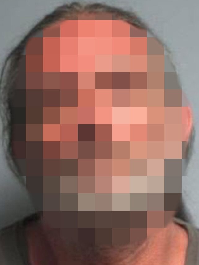 A police-issued mugshot of the accused man who holds ‘conspiracy theories’. The Advertiser can’t reveal his face for legal reasons. Picture: SA Police