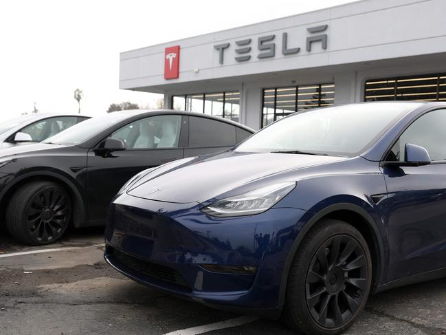 CORTE MADERA, CALIFORNIA - DECEMBER 20: New Tesla cars are displayed at a Tesla dealership on December 20, 2024 in Corte Madera, California. Electric car maker Tesla is recalling 700,000 vehicles over a tire pressure warning system that could fail to warn drivers of low tire pressure. 2024 Cybertrucks, 2017-2025 Model 3 and 2020-2025 Model Y are being recalled.   Justin Sullivan/Getty Images/AFP (Photo by JUSTIN SULLIVAN / GETTY IMAGES NORTH AMERICA / Getty Images via AFP)