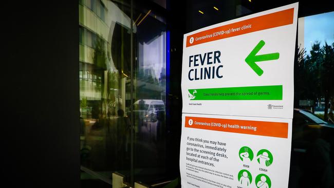 A sign directing visitors to the fever clinic at the Gold Coast University Hospital. Photo by Patrick HAMILTON / AFP