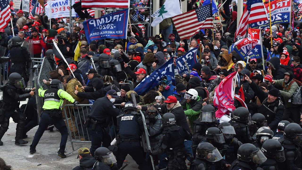 Trump supporters clash with police and security forces as they push barricades to storm the US Capitol. Picture: Roberto Schmidt/AFP