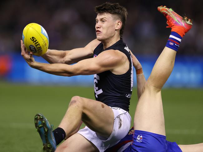 Sam Walsh gets a handball away. Picture: Michael Klein