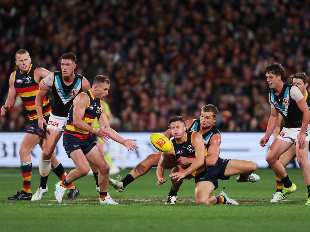 Showdown medallist Jake Soligo fires out a handpass. Picture: James Elsby/AFL Photos