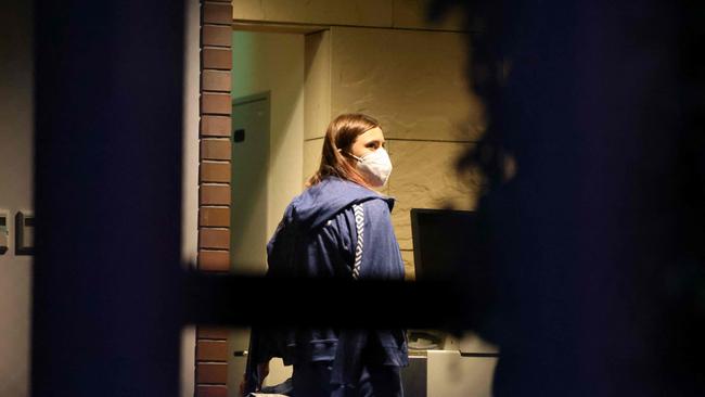 Belarus athlete Krystsina Tsimanouskaya, who claimed her team tried to force her to leave Japan following a row during the Tokyo 2020 Olympic Games, walks with her luggage inside the Polish embassy in Tokyo. Picture: AFP