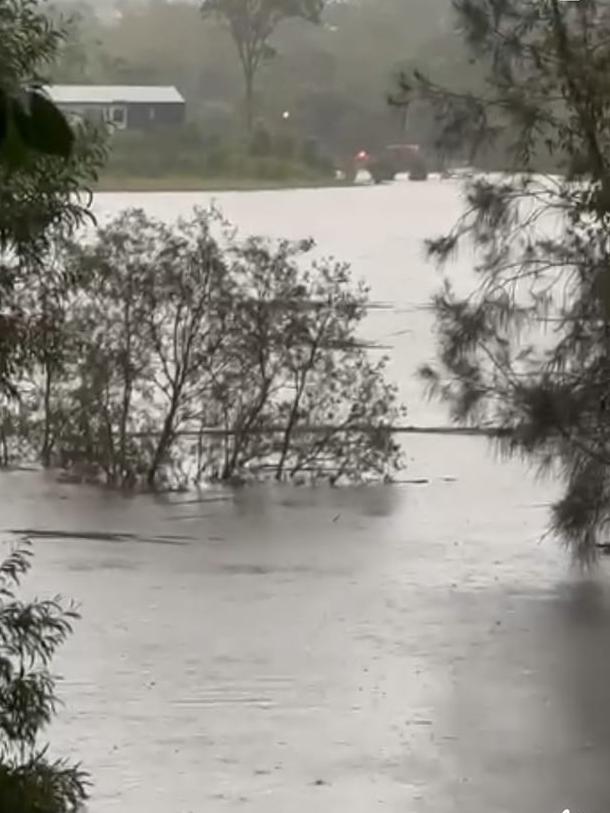 Mudgeeraba Rd is underwater as intense rainfall lashes the Gold Coast. Picture: Supplied/Facebook