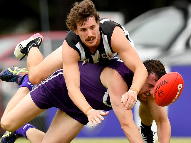 Tim Jones of Ringwood and Alex Brown of Templestowe compete for the ball during the round one EFNL Division 2 Eastland Senior Mens match between Templestowe and Ringwood at Templestowe Reserve, on April 06,2024, in Melbourne, Australia. (Photo by Josh Chadwick)