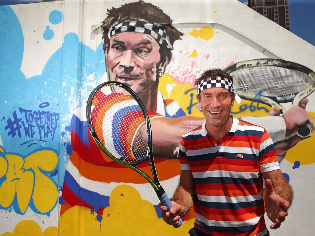 Pat Cash of Australia poses after painting street art with Melbourne graffiti artist Daniel Wenn (unseen) during the ellesse Tennis Performance Apparel Launch on January 17, 2014 in Melbourne, Australia. The new range of tennis performance apparel will be worn by Feliciano Lopez, Elina Svitolina and Monica Puig at the Australian Open. (Photo by Scott Barbour/Getty Images for ellesse)