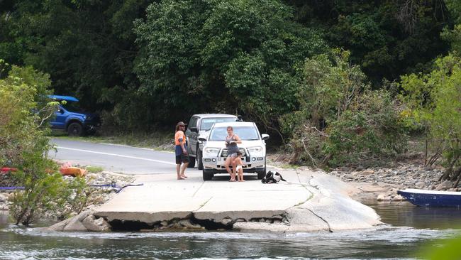 Goldsborough Valley locals wait for school kids to cross the river. Picture: Peter Carruthers