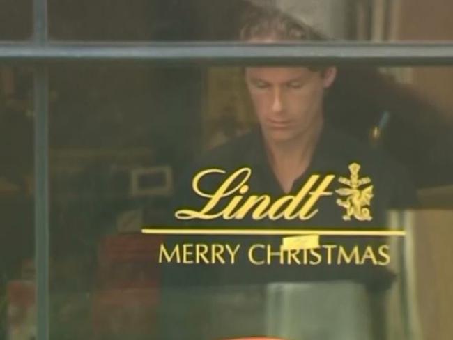 Lindt manager Tori Johnson at the window of the cafe during the siege. Picture: Channel 7