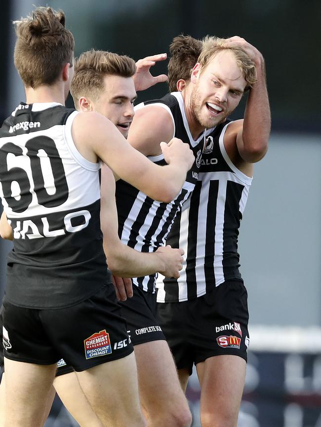 Jack Watts celebrates a goal with Port teammates. Picture: Sarah Reed