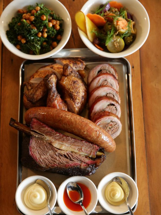 Mmmmmm meat feast. All the smoked meats (lamb belly, Merguez sausage and beef rib) on a tray with sides.