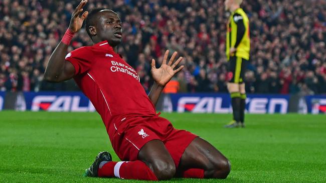 (FILES) In this file photo taken on February 27, 2019 Liverpool's Senegalese striker Sadio Mane celebrates after scoring the opening goal of the English Premier League football match between Liverpool and Watford at Anfield in Liverpool, north west England. - Premier League clubs will return to training in small groups from Tuesday after the latest stage of "Project Restart" was approved on Monday, May 18. (Photo by Anthony DEVLIN / AFP) / RESTRICTED TO EDITORIAL USE. No use with unauthorized audio, video, data, fixture lists, club/league logos or 'live' services. Online in-match use limited to 120 images. An additional 40 images may be used in extra time. No video emulation. Social media in-match use limited to 120 images. An additional 40 images may be used in extra time. No use in betting publications, games or single club/league/player publications. /