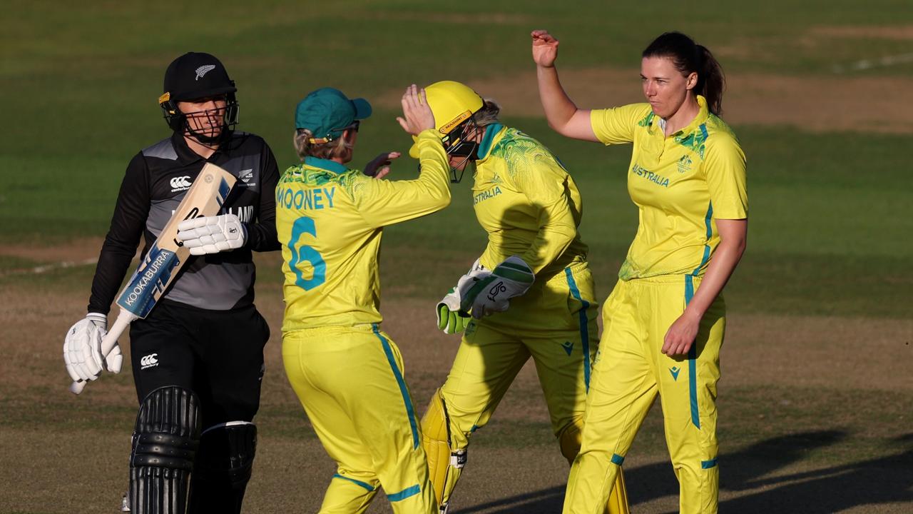 Tahlia McGrath celebrates with Beth Mooney after bowling Lea Tahuhu.