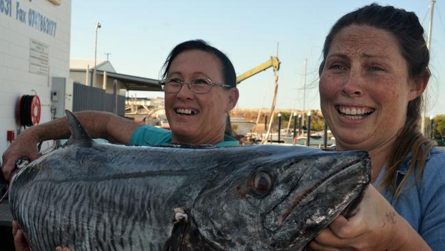 Anita Russell and Chloe Bauer from Bowen Fishermans Seafood with a 21 kilogram Spanish mackerel Photo: John Andersen