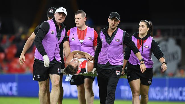 Trainers stretcher Bailey Rice off the ground after he clashed heads with a teammate. Picture: AAP