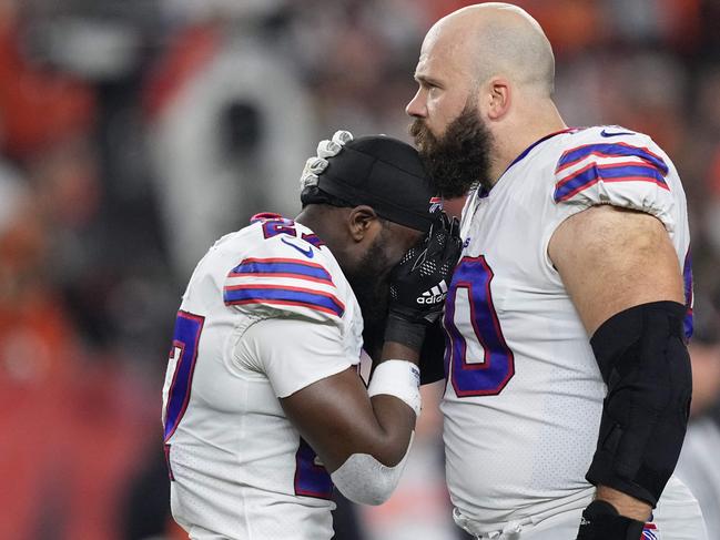 (FILES) In this file photo taken on January 2, 2023, Tre'Davious White, #27, and Mitch Morse, #60 of the Buffalo Bills, react to teammate Damar Hamlin, #3, collapsing after making a tackle against the Cincinnati Bengals during the first quarter at Paycor Stadium in Cincinnati, Ohio. - The on-field cardiac arrest suffered by Buffalo Bills safety Damar Hamlin may have been the result of a "perfect storm" of events in which a blow to the chest was combined with a split-second moment of vulnerability during a heartbeat, experts said on January 4, 2023. (Photo by Dylan Buell / GETTY IMAGES NORTH AMERICA / AFP)