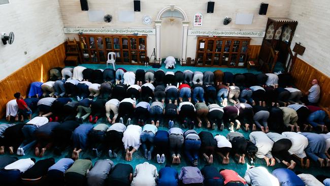 Muslims offering prayers as local community gather to pay their respects for the Christchurch mosques victims during an Open Day at Preston mosque in Melbourne. Australia. Picture: AFP 