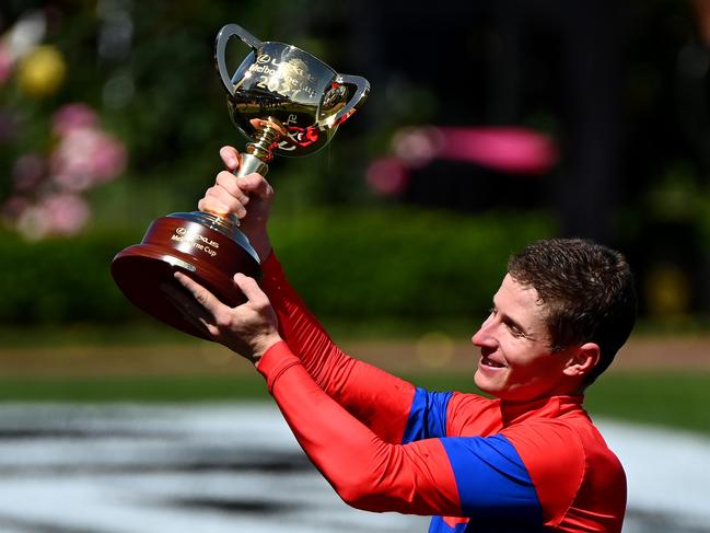 Winning jockey James Mcdonald celebrates with the cup. Picture: Quinn Rooney/Getty Images