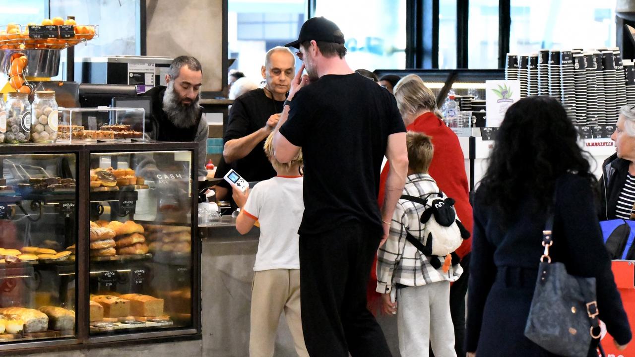 Hemsworth and his family took a moment to grab a snack at the airport ahead of heading home. Picture: Backgrid