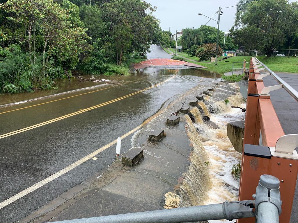 Flooding at Ithaca creek bridge on bowman road in Bardon on Monday. Picture: Brad Fleet