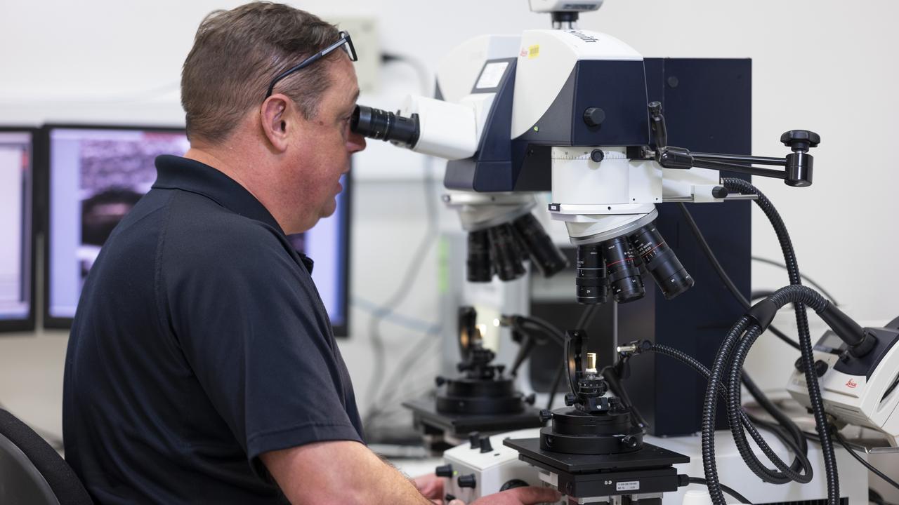 AFP experts working at the Majura Forensic Facility in Canberra. Picture: NCA NewsWire / Martin Ollman