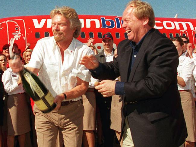 Jul 09 2000 - Virgin blue launch at Brisbane airport  - Richard Branson  and Peter Beattie with champagne surrounded by staff - aviation airlines aircraft personnel