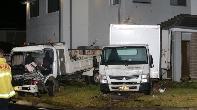 The trucks spun out of control and ended up both reversed into a house. Picture Bill Hearne