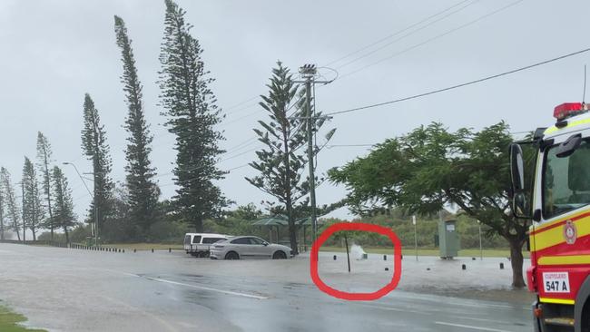 The swamped silver Porsche next to the ringed steaming power box on the road to Cleveland Point, often referred to as Millionaires’ Row.