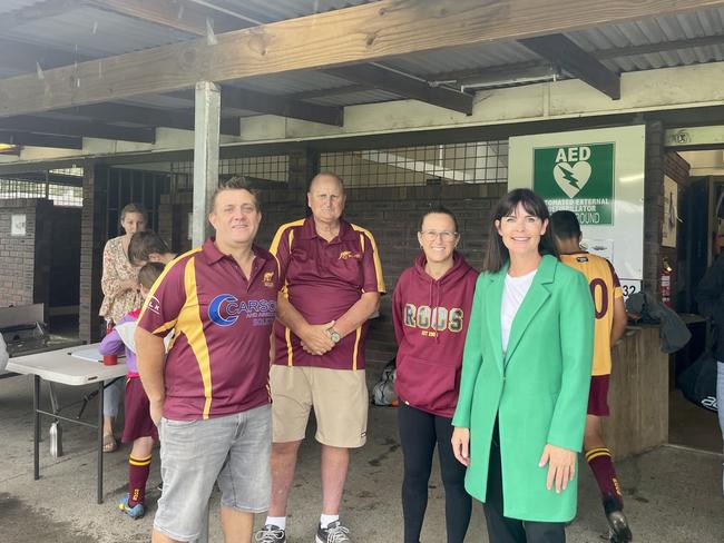 Robertson federal Liberal MP Lucy Wicks with members of the Kincumber Roos Football Club as the Liberal party promises to upgrade the facilities