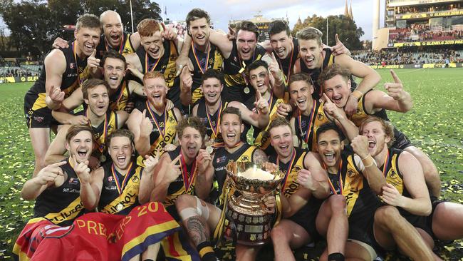 Glenelg celebrates its drought-breaking premiership at Adelaide Oval on Sunday. Picture: SARAH REED.