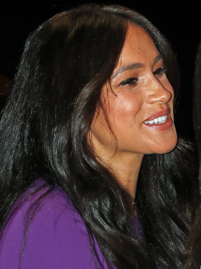 Meghan greeted a friend at the event. Picture: Getty Images