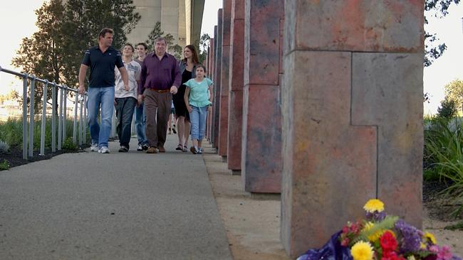 Survivor Bob Setka and his family at the memorial park dedicated to those who perished.