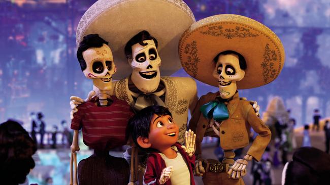 In a scene from Disney Pixar's animated film Coco, aspiring musician Miguel (voiced by Anthony Gonzalez) journeys through the Land of the Dead in search of his idol Ernesto de la Cruz (centre, Benjamin Bratt). ©2017 Disney Pixar. All Rights Reserved.